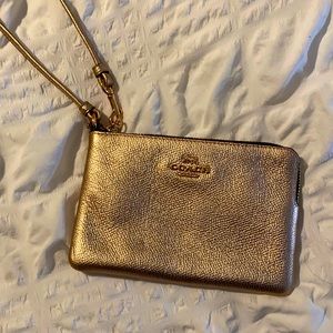 Rose gold Coach Wristlet
